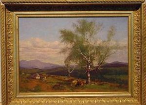 Cows Grazing In A Valley