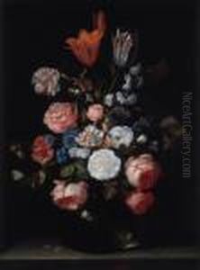 Roses, Tulips, Carnations And Other Flowers In A Glass Vase On A Stone Ledge