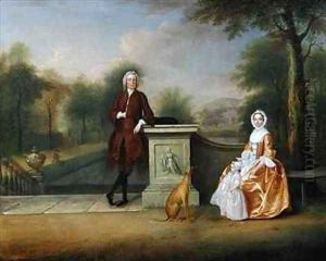 The Hon Robert Cholmondeley his wife and son in a garden