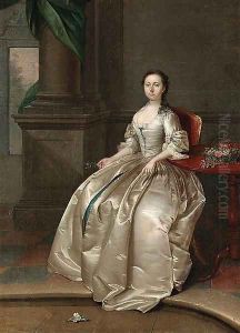 Portrait of a Lady, full-length, seated in a white satin dress, beside a table with a basket of flowers, a sprig of orange blossom in her right hand