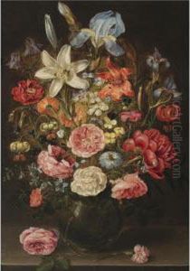 A Still Life Of Lilies, Roses, 
Iris, Pansies, Columbine, Love-in-a-mist, Larkspur And Other Flowers In A
 Glass Vase On A Table Top, Flanked By A Rose And A Carnation