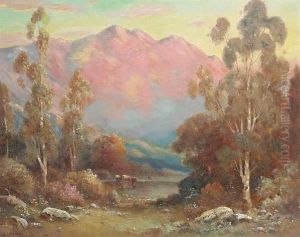 Cattle Watering With Pink Mountains In The Distance