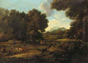 A wooded landscaoe with figures by a lake