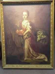 Girl With Basket Of Fruit In A Landscape