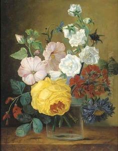 Mixed flowers in a glass vase on a ledge