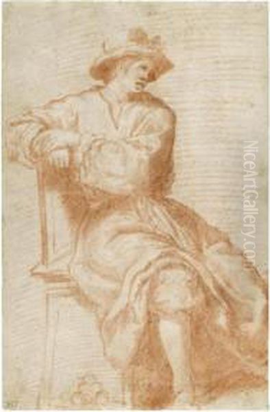 A Seated Young Man Wearing A Hat - view 1