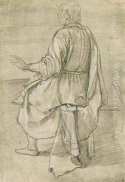 A seated young man seen from behind - view 1