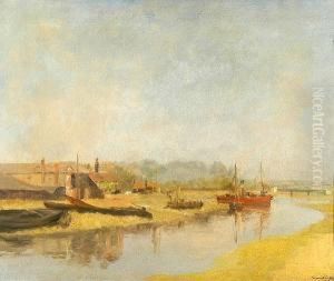 Vessels On The River Shore With Buildings Beyond