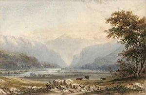 Evening, cattle grazing by a lake