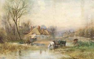 Horses pulling cart watering in a river by a rural village