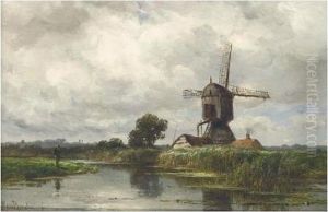 An Angler Near A Wind Mill