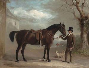 A bay hunter held by a groom, with a dandie dinmont, outside a stable, huntsmen and hounds beyond
