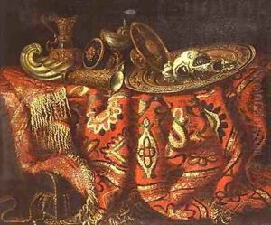 A nautilus cup a paten ewers and a gilt dish on a carpet draped over a ledge