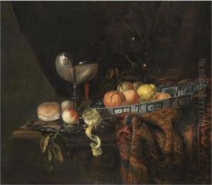 A Still Life With Oranges,
Peaches And A Lemon In A Blue-and-white China Bowl, A Silver-gilt
Nautilus Cup On A Silver Gilt Plate Together With A Lemon, A Bread Roll
And A Knife, Together With A Roemer And A Wine Glass, All On A
Partly-draped Table by Juriaen van Streeck