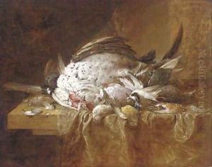 A dead turkey and songbirds on a partly-draped table by Jan Fyt