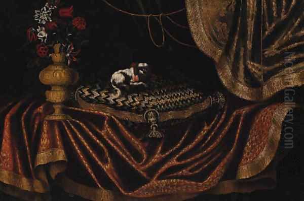 A toy spaniel on an embroidered cushion with a vase of flowers on a draped table - view 1
