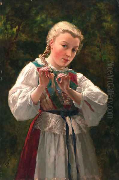 A young girl braiding her hair - view 1