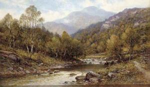 An angler on the bank of a river