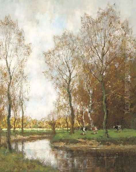 Cows grazing by a stream in a wooded landscape - view 1
