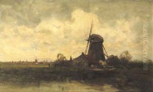 A windmill along a river by Charles Paul Gruppe
