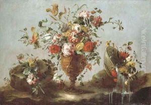 Roses, peonies and tulips in a gold sculpted urn with flowers in a pewter bowl by a rock pool by Francesco Guardi