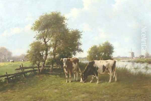 Cattle grazing by a river in summer - view 1