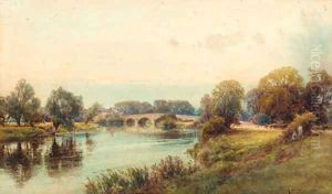 Figures seated on a river bank before a village by Frank Gresley