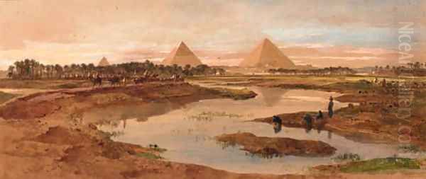 A camel train with the pyramids beyond - view 1