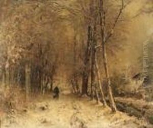 A Man Walking His Dog In A Snow-clad Wooded Lane