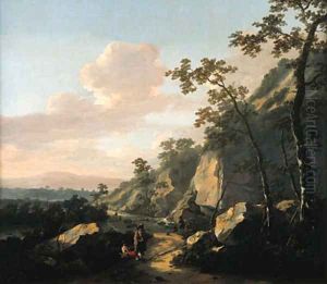 A rocky landscape with travelers on a path