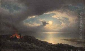 A moonlit coastal landscape with men preparing a fire