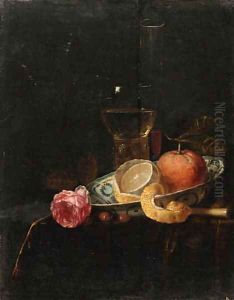 A partly peeled lemon and an orange in a blue and white Wanli 'kraak' porselein dish, a roemer a wineglass and a rose on a draped table by Jacob van Hulsdonck