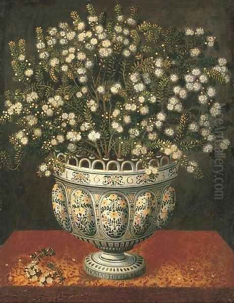 Myrtle in a lobed-footed polychrome maiolica Manises vase on a draped ledge - view 1
