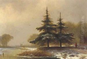 A sportsman on a wooded riverbank in winter