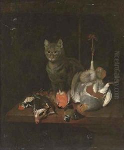 A cat seated on a wooden table with dead birds