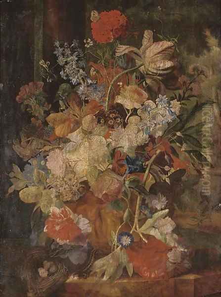 Tulips, morning glory, and other flowers in a sculpted urn with a birds nest on a ledge, figures in a garden beyond - view 1
