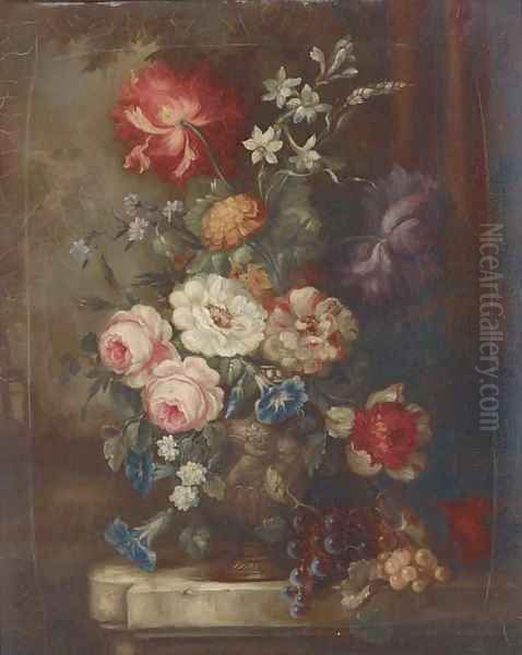 Roses, petunias, dahlias, campanulae and other summer flowers in an ornamental urn with bunches of grapes on a garden plinth - view 1