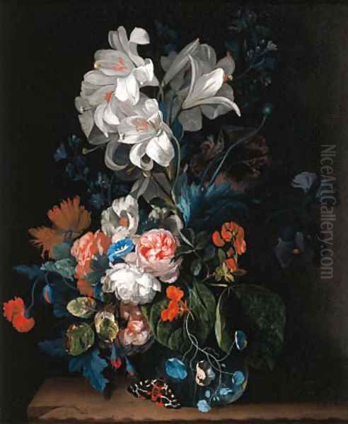Lilies, roses, carnations and other flowers in a glass vase on a stone ledge with a butterfly - view 1