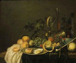 Grapes, a peeled lemon, an orange and cherries on a Wan-li dish
