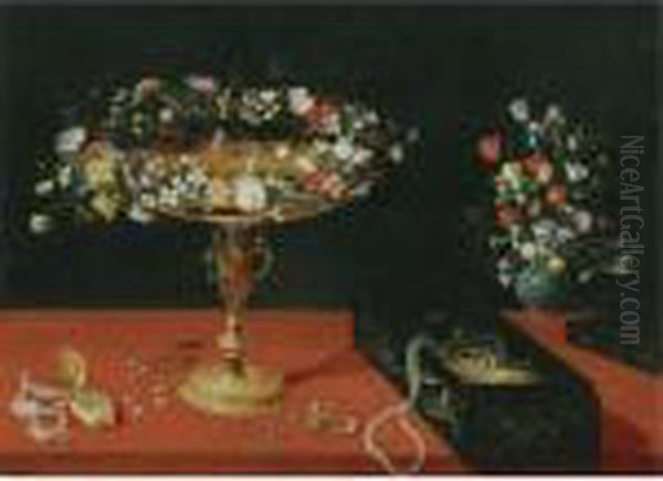Still Life With A Garland Of
Flowers On A Gold Tazza, A Box Of Jewellery, A Gold Pocket Watch And A
Vase Of Flowers, All Arranged On A Table Draped In Red - view 1
