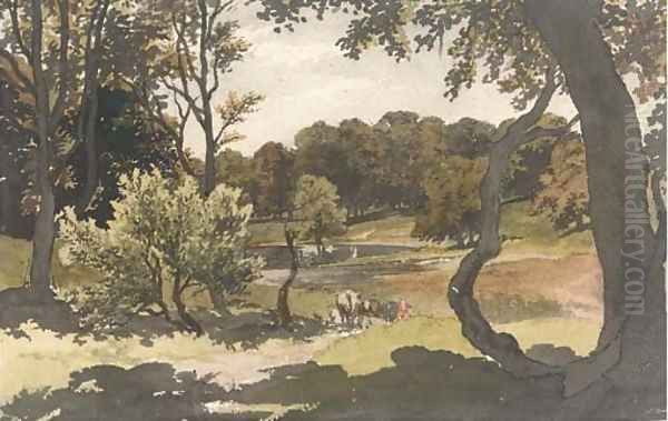 Cows grazing in a wooded landscape - view 1