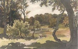 Cows grazing in a wooded landscape