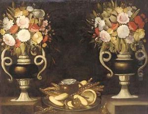 Mixed flowers in a pair of urns, bread, a jug of wine and figs on a silver dish on a ledge by Tomas Hiepes