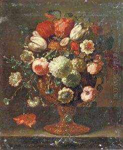 Roses, tulips, violets, hydrangeas and other flowers in an earthenware vase on a stone ledge