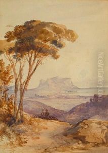 Coastal Landscape With Large Rocky Outcrop In The Distance