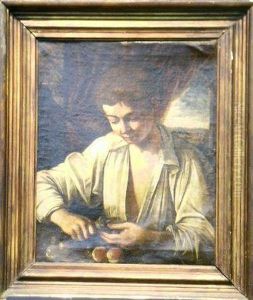 Boy Cutting Fruit by Annibale Carracci