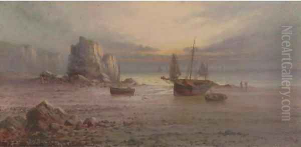 The sun setting over a rocky beach - view 1