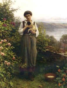 Young Girl Holding A Puppy