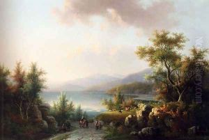 A Wooded Hilly Landscape With Travellers On A Track Near A Lake