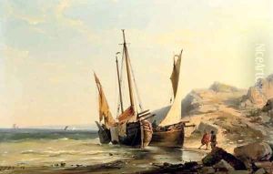Boats moored by a rocky beach